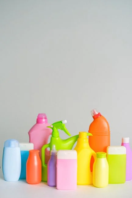 person-holding-yellow-plastic-spray-bottle-zmnefoi3k